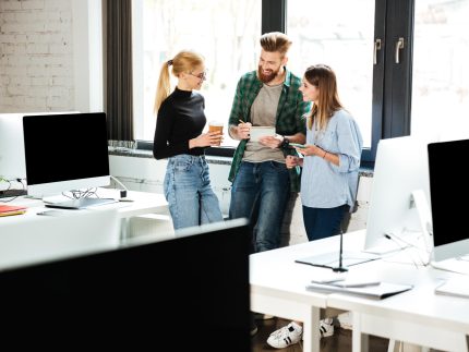 young-concentrated-colleagues-office-talking-with-each-other